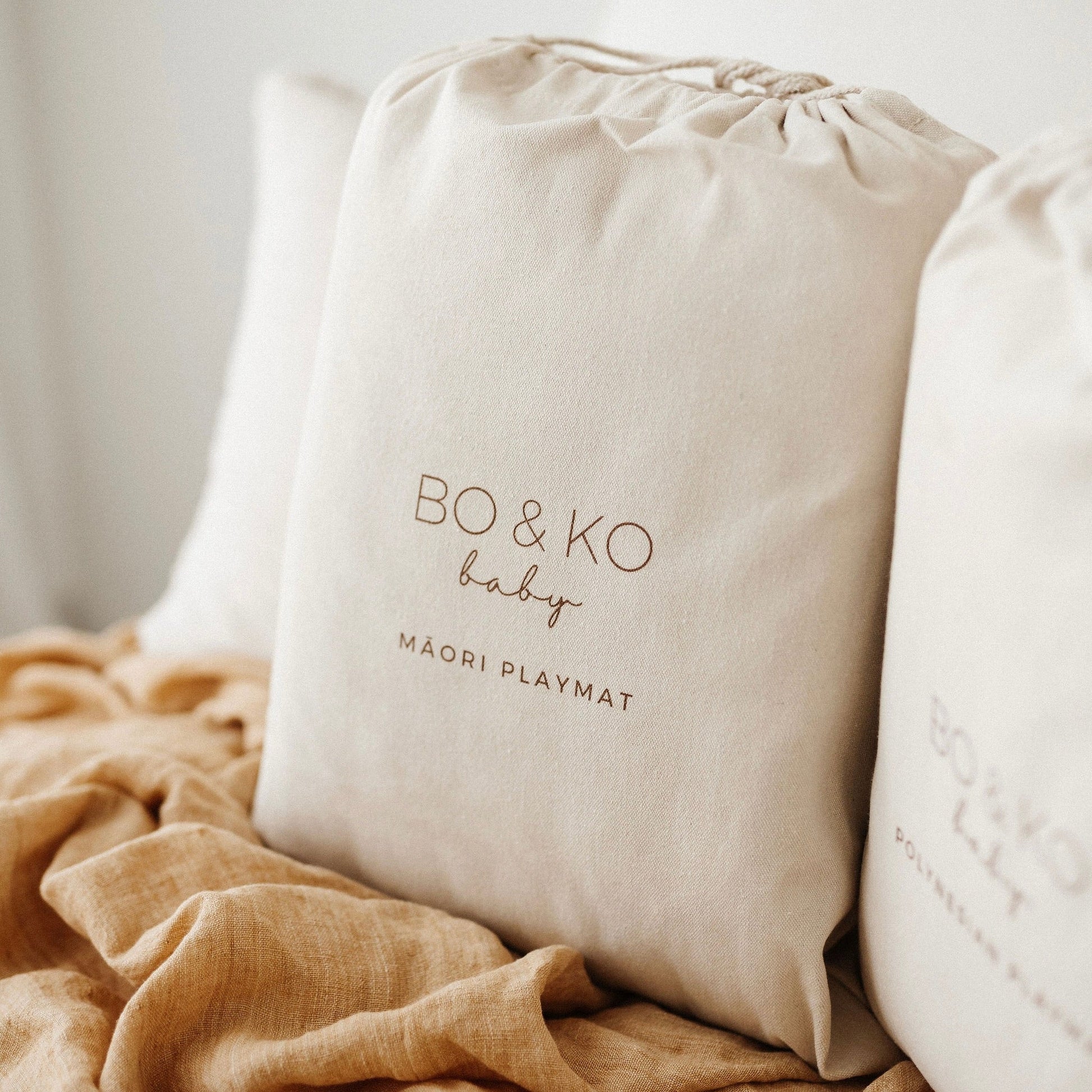 BO & KO Baby Māori Inspired Playmat | Tan available at Bear & Moo