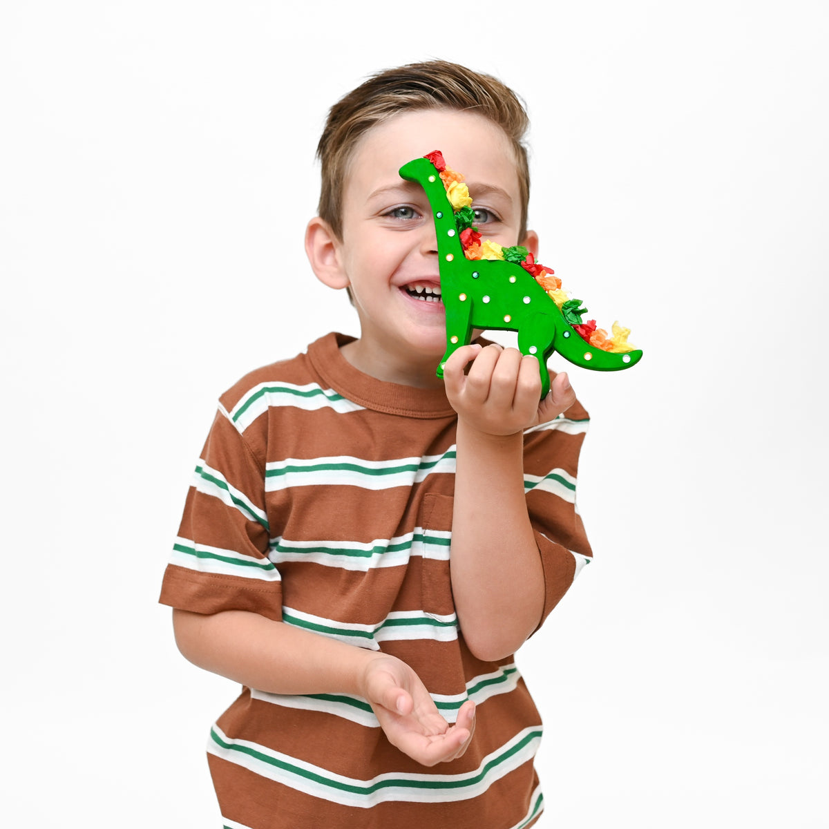 My Creative Box Dinosaur Craft and Activity Box, child playing with a finished dinosaur craft